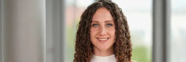 portrait of a curly young woman